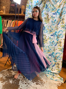 Blue pleated chiffon gown with pink sash