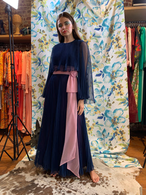 Blue pleated chiffon gown with pink sash