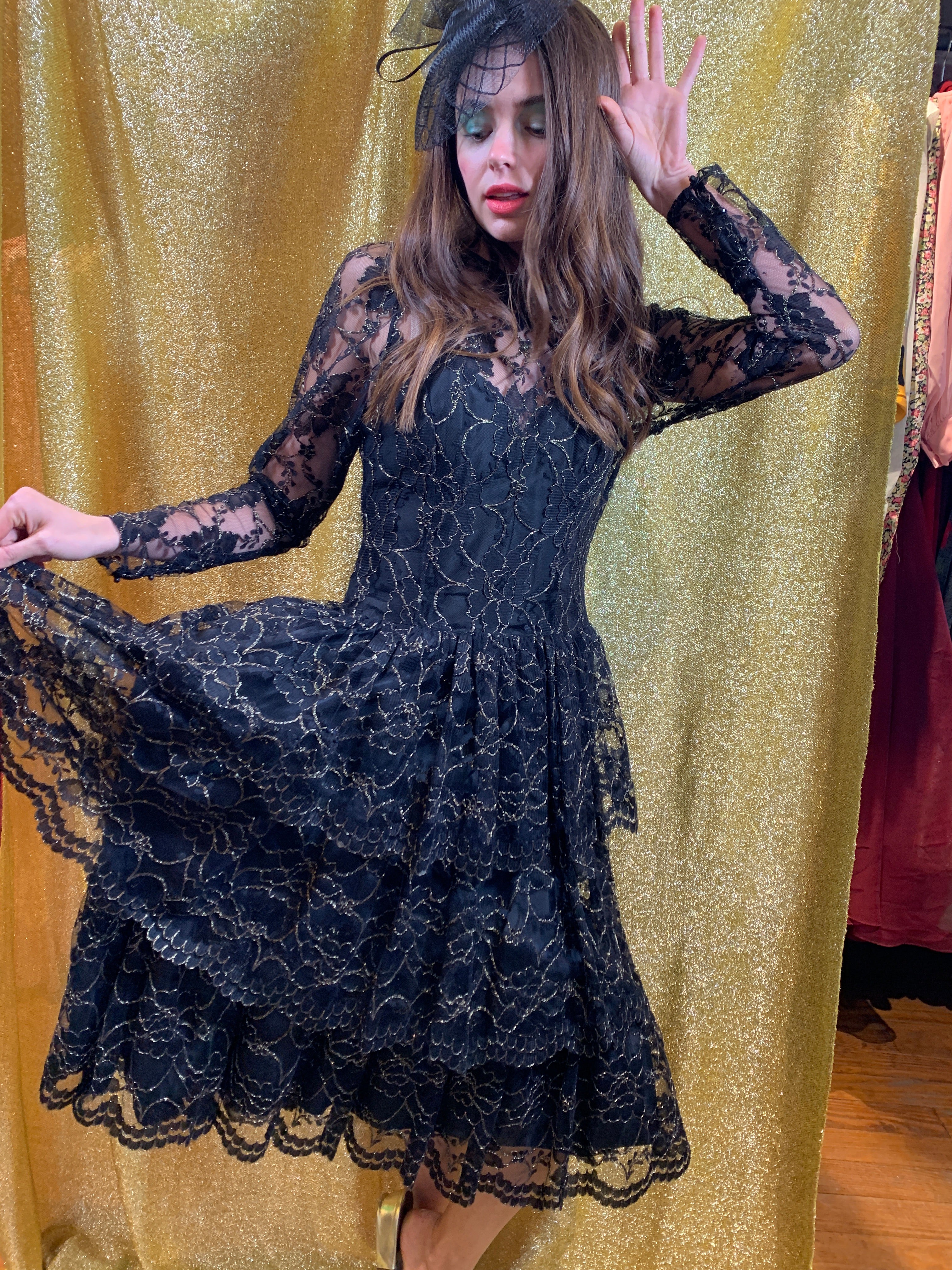 Black tiered lace dress with shots of gold